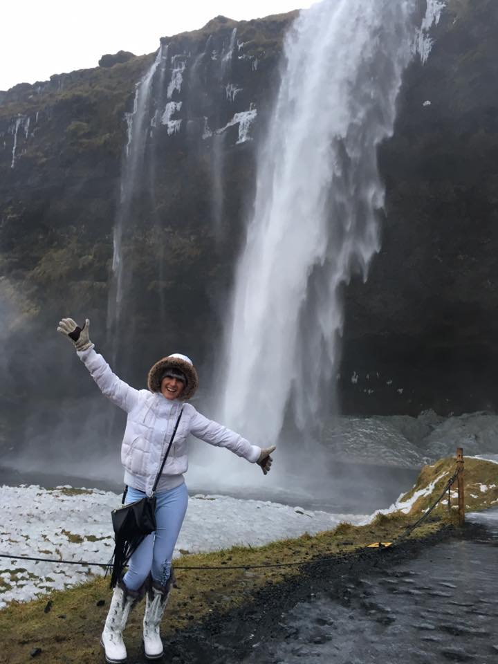 Standing in front of the waterfall at Seljalandsfoss