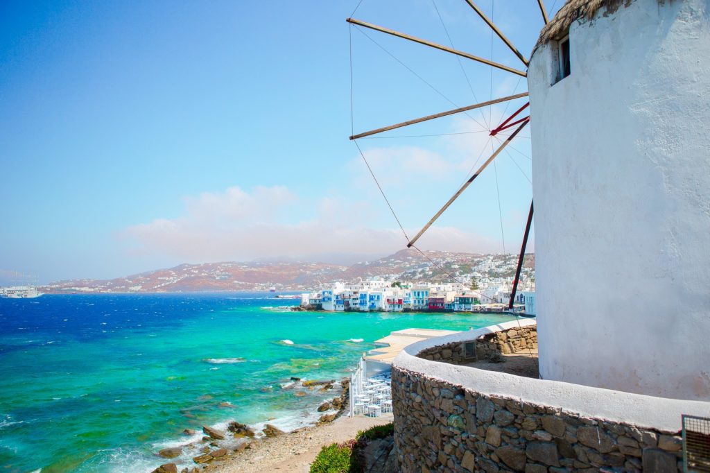 Famous view of traditional greek windmills on Mykonos island at sunrise, Cyclades, Greece