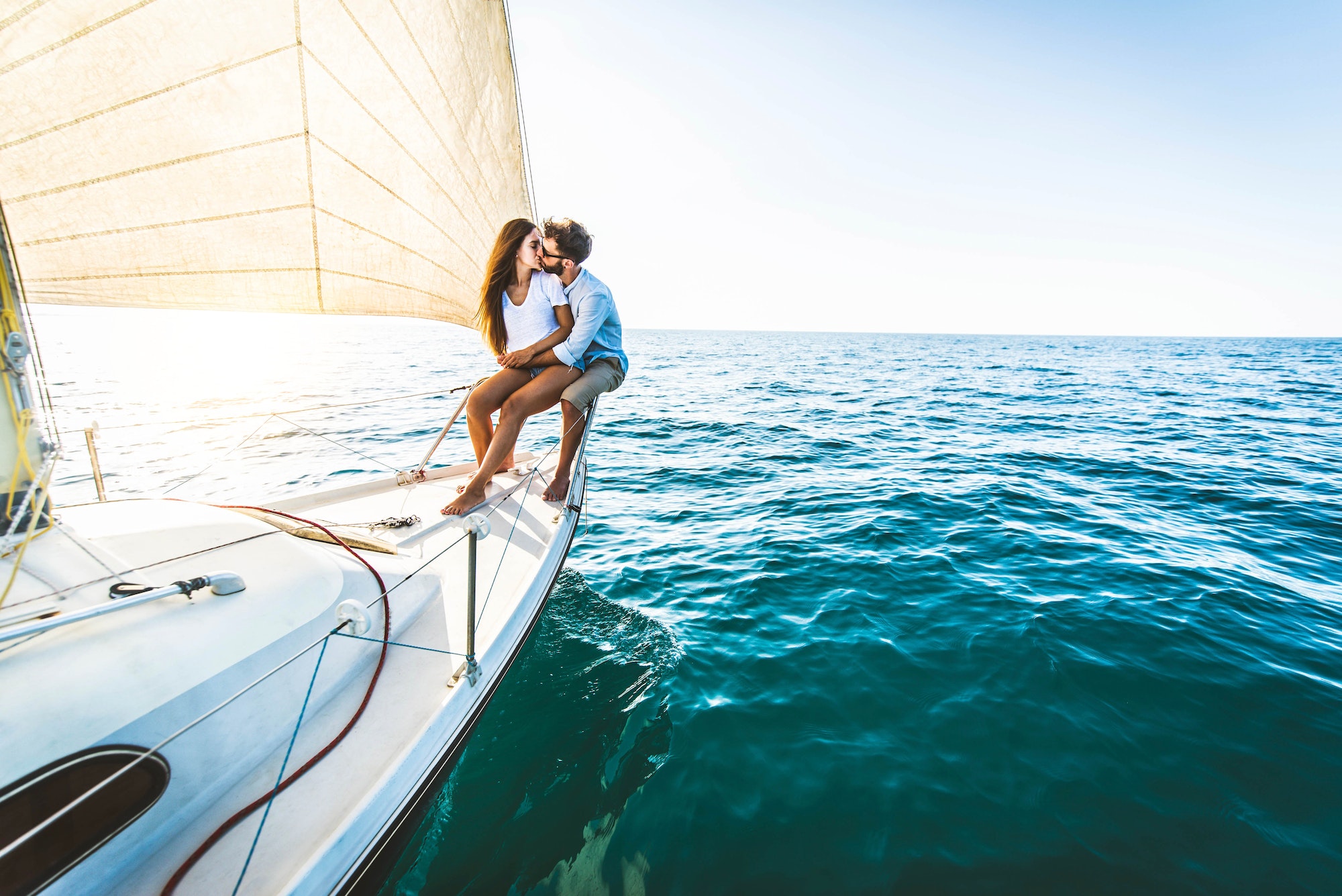 Young couple relaxing on yacht cruise